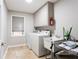 Laundry room with washer, dryer, and utility sink at 790 Oakhaven Dr, Roswell, GA 30075