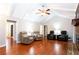 Hardwood floor living room with vaulted ceilings and multiple seating areas at 790 Oakhaven Dr, Roswell, GA 30075