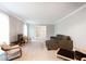 Spacious living room with plush seating and large windows at 790 Oakhaven Dr, Roswell, GA 30075