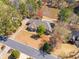 Stunning lakefront property featuring a large lot, mature trees, and a private backyard swimming pool at 19 Spring Lake Trl, White, GA 30184