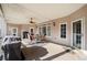 Relaxing covered back porch with ceiling fan, grill and outdoor seating at 19 Spring Lake Trl, White, GA 30184
