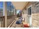 Relax on this partially covered back porch with rocking chairs and a beautiful view of the trees at 19 Spring Lake Trl, White, GA 30184