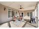 Covered back porch perfect for entertaining with ceiling fan, and large windows at 19 Spring Lake Trl, White, GA 30184