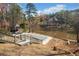 Backyard view of the covered pool, gazebo and a lake in the background at 19 Spring Lake Ne Trl, White, GA 30184