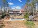 Multi-level decks and stairs lead to a pool and gazebo at 19 Spring Lake Trl, White, GA 30184