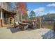 Spacious outdoor deck with comfortable seating and lovely view of the lake and fall foliage at 19 Spring Lake Trl, White, GA 30184