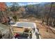 View of the covered pool, gazebo and lake from the second story deck at 19 Spring Lake Trl, White, GA 30184