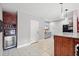 Wet bar includes a microwave, wine cooler, and shelving for storing beverages at 19 Spring Lake Trl, White, GA 30184