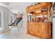 Entertaining space includes a large custom-built bar with a basketball game for added fun at 19 Spring Lake Trl, White, GA 30184