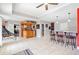 Entertaining basement with a full bar, additional seating, and tile flooring at 19 Spring Lake Trl, White, GA 30184