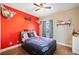 Cozy bedroom showcases colorful decor, hardwood floors, and ample natural light at 19 Spring Lake Trl, White, GA 30184