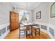 Cozy dining room with modern lighting and wooden furniture, perfect for Gathering meals at 19 Spring Lake Ne Trl, White, GA 30184