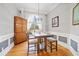 Formal dining area with hardwood floors and custom trim, offering a refined space for meals and gatherings at 19 Spring Lake Trl, White, GA 30184