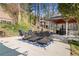 Covered gazebo featuring a bar area and seating, beside the covered pool at 19 Spring Lake Trl, White, GA 30184