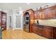 Kitchen boasts custom cabinetry, granite counters, pantry, and stainless steel refrigerator at 19 Spring Lake Trl, White, GA 30184
