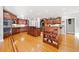 Spacious kitchen with two islands, ample counter space, custom wood cabinetry and hardwood floors at 19 Spring Lake Trl, White, GA 30184