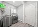 Well-equipped laundry room with modern washer and dryer set at 19 Spring Lake Ne Trl, White, GA 30184