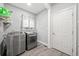 Well-equipped laundry room with modern washer and dryer units and ample storage at 19 Spring Lake Trl, White, GA 30184