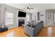 Bright living room features a fireplace, hardwood floors, and ample seating for comfortable living at 19 Spring Lake Trl, White, GA 30184