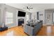 Inviting living room features hardwood floors, a fireplace, and a comfortable gray sofa at 19 Spring Lake Trl, White, GA 30184