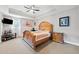 Spacious main bedroom features a tray ceiling, ceiling fan, and an en-suite bathroom at 19 Spring Lake Trl, White, GA 30184
