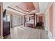 Spacious main bedroom with tray ceilings, a four-poster bed, and access to the backyard at 19 Spring Lake Trl, White, GA 30184
