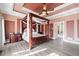 Spacious main bedroom with tray ceilings, a four-poster bed, and access to the backyard at 19 Spring Lake Trl, White, GA 30184