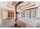 Spacious main bedroom with tray ceilings, a four-poster bed, and access to the backyard at 19 Spring Lake Trl, White, GA 30184