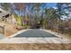 Large, covered pool beside the lake, with a covered gazebo and wooded views at 19 Spring Lake Trl, White, GA 30184