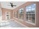 Bright sunroom with white tile floor, lots of windows, and backyard access at 19 Spring Lake Trl, White, GA 30184