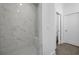 Modern bathroom with a glass-enclosed shower, tiled walls, and a built-in bench at 1980 Flying Scotsman Dr # 10, Kennesaw, GA 30144