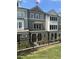 Inviting townhome with a covered entrance, brick detailing, and manicured landscaping, adding to its curb appeal at 1980 Flying Scotsman Dr # 10, Kennesaw, GA 30144