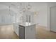 Bright kitchen with stainless steel appliances, white cabinetry and quartz countertops at 1980 Flying Scotsman Dr # 10, Kennesaw, GA 30144