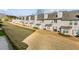 Row of townhouses viewed from above, showcasing uniform design and landscaping at 4658 Grand Central Pkwy, Decatur, GA 30035