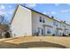 Townhouse backyard with grassy area and a view of neighboring homes at 4658 Grand Central Pkwy, Decatur, GA 30035