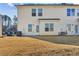 Private backyard with a patio, grassy area, and space for outdoor furniture at 4658 Grand Central Pkwy, Decatur, GA 30035