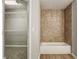 Bathroom with shower/tub combo and tiled walls at 4658 Grand Central Pkwy, Decatur, GA 30035