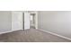 Bright bedroom with carpet flooring and access to another room at 4658 Grand Central Pkwy, Decatur, GA 30035