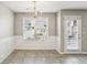 Bright dining room with chandelier and access to patio at 4658 Grand Central Pkwy, Decatur, GA 30035