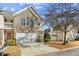 Two-story townhouse with brick exterior, attached garage, and mature trees at 4658 Grand Central Pkwy, Decatur, GA 30035