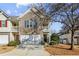 Brick front townhouse with two-story elevation, attached garage, and manicured landscaping at 4658 Grand Central Pkwy, Decatur, GA 30035