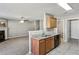 Kitchen with granite countertops, breakfast bar, and access to living room at 4658 Grand Central Pkwy, Decatur, GA 30035