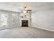 Living room with a fireplace, large windows, and neutral decor at 4658 Grand Central Pkwy, Decatur, GA 30035