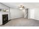 Open living area with fireplace, neutral walls and carpet flooring at 4658 Grand Central Pkwy, Decatur, GA 30035