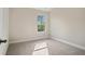 Bright bedroom with neutral walls, carpet, and a window at 500 Paces Dr, Lithia Springs, GA 30122