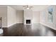 Spacious living room featuring hardwood floors, fireplace, and large windows at 500 Paces Dr, Lithia Springs, GA 30122
