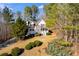House nestled in a wooded area with a driveway at 121 Rachel Blvd, Temple, GA 30179