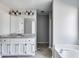 Main bathroom with granite countertop, white cabinets, and bathtub at 121 Rachel Blvd, Temple, GA 30179