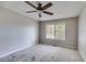 Bright bedroom with ceiling fan and large window at 121 Rachel Blvd, Temple, GA 30179