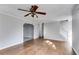 Spacious living room with hardwood floors and ceiling fan at 121 Rachel Blvd, Temple, GA 30179